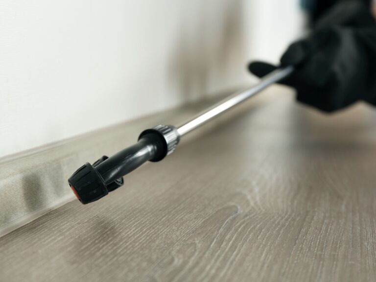 Pest control nozzle spraying a commercial space
